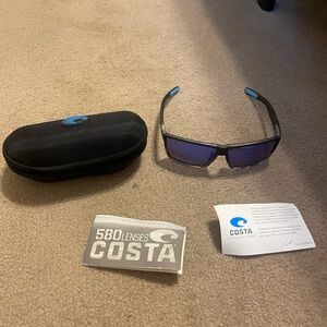 Costa Black Frame Sunglasses with Vibrant Blue Lenses